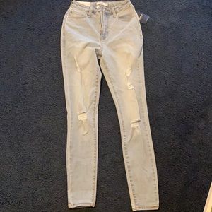 Cute light blue jeans with rips never worn